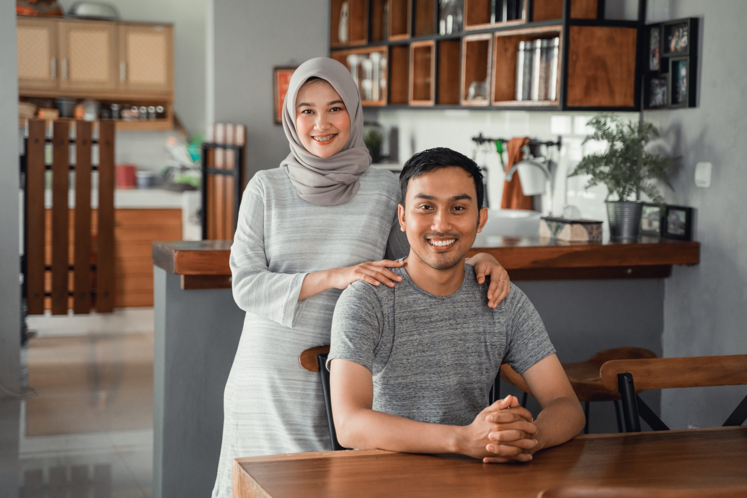 muslim-couple-sitting-dining-room-together-scaled.jpg